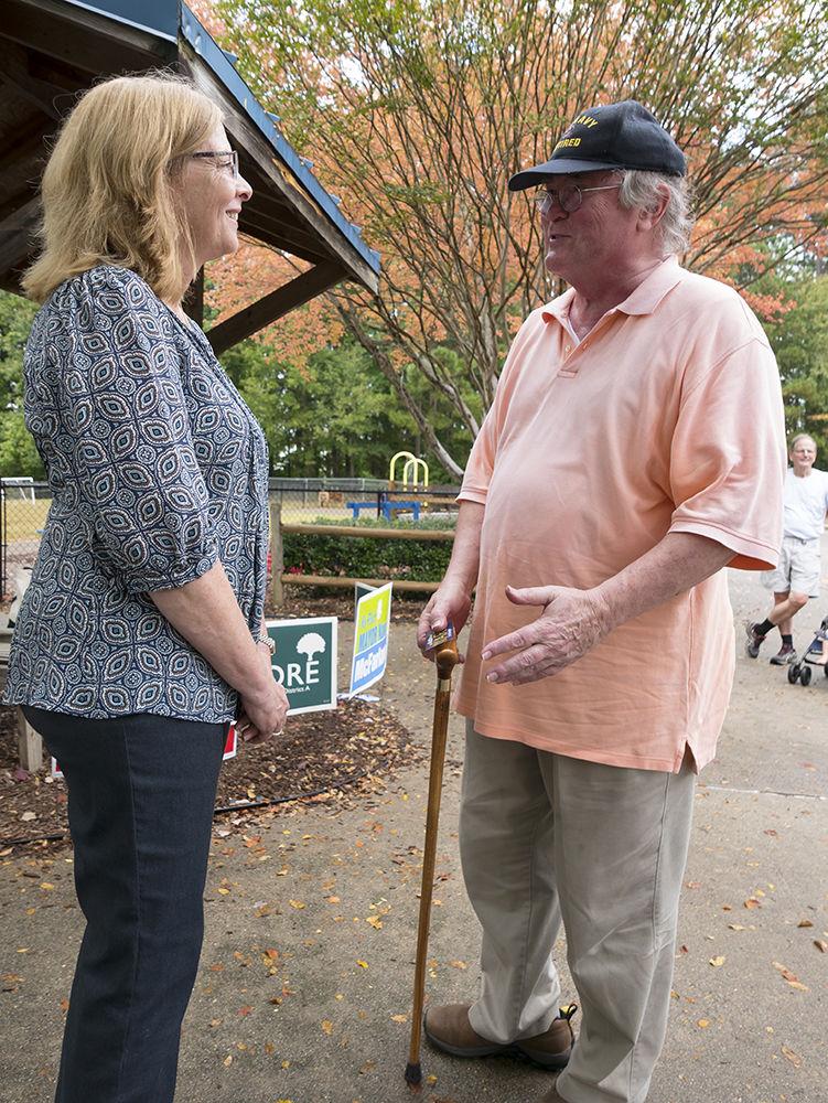 Mayor Nancy McFarlane speaks to a Navy Veteran on his way to the polls at Lead Mine Elementary School, in North Raleigh on Tuesday, Oct. 10.