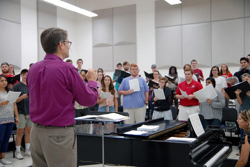 Director of choral activities Nathan Leaf directs the State Chorale during their normally scheduled class time in Price Music Center Thursday. Leaf directs all NC State choral ensembles including State Chorale, a coed ensemble as well as Vox Accalia women's choir and the Singing Statesmen men's choir. As NC State&#8217;s premier choral ensemble, the State Chorale generally draws from the more experienced talent of the aforementioned men's and women's choirs.