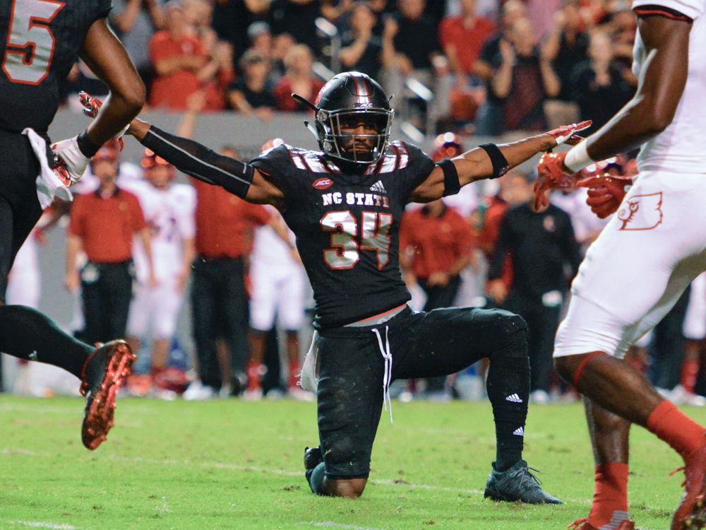 Sophmore safety Tim Kidd-Glass celebrates his forced incomplete pass. The Wolfpack won the game 39-25 in Carter Finley Stadium on Thursday, Oct 5.