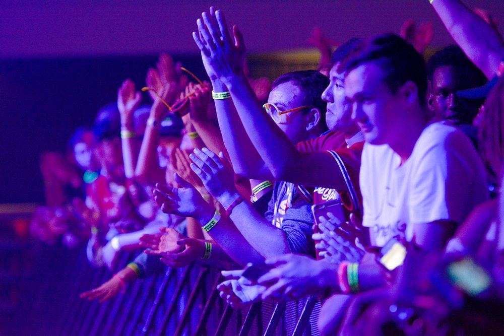 Fans line the floor excited for K CAMP to take the stage. The NC State Homecoming Concert is organized by UAB as a part of Red and White week at NC State. The concert took place at Reynolds Coliseum on Friday, Oct. 27.