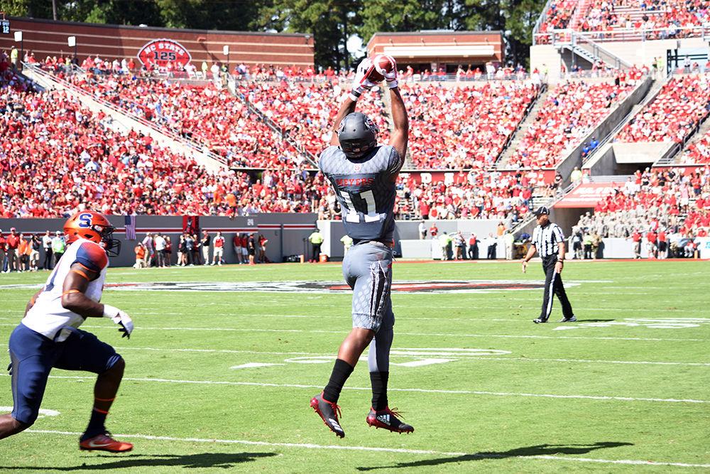 Redshirt sophomore wide receiver Jakobi Meyers receives a pass from Finley during the game against Syracuse in Carter-Finley Stadium, Saturday, Sept. 30, 2017. Meyers received for a total of 57 yards this game. NC State won against Syrcause, 33-25, making this game the 200th Wolfpack Win in Carter-Finley Stadium.