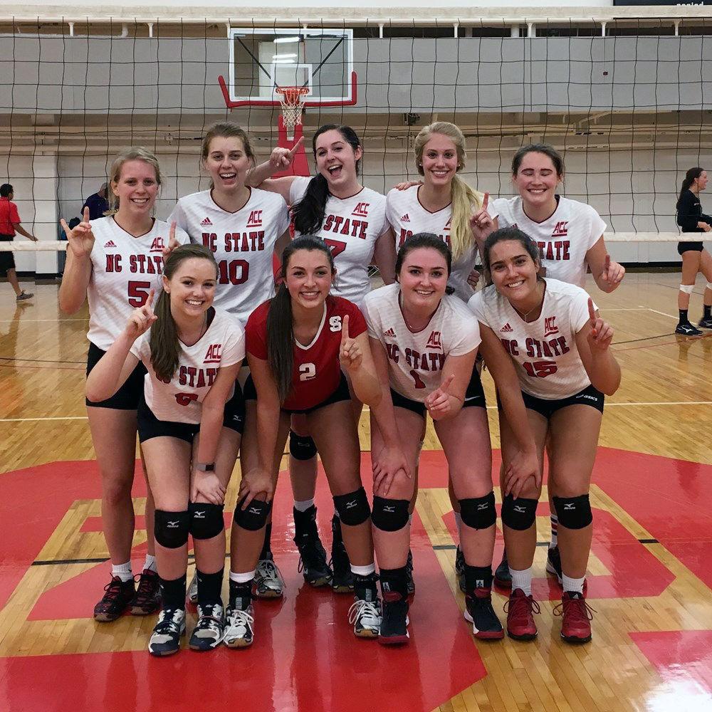 The NC State women's club volleyball team poses for a team picture in Carmichael Gym. The team won Nationals last year.