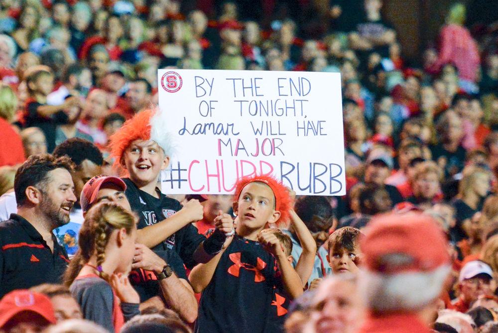 NC State fans hold up a sign during the game agaisnt the Louisville Cardinals. The Wolfpack would win the game 39-25 in Carter Finley Stadium on Thursday, Oct 5.