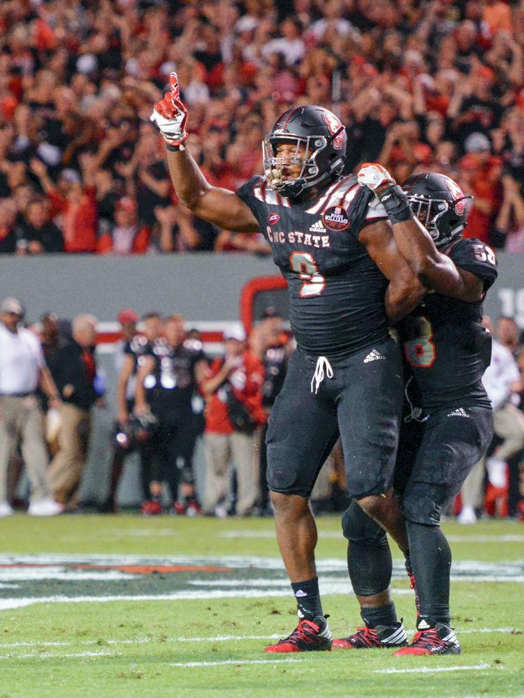 Senior defensive end Bradley Chubb celebrates after getting a sack during the game against Louisville. Chubb had six tackles with one sack for a loss of 4 yards. The Wolfpack won 39-25 in Carter Finley Stadium on Thursday, Oct. 5.