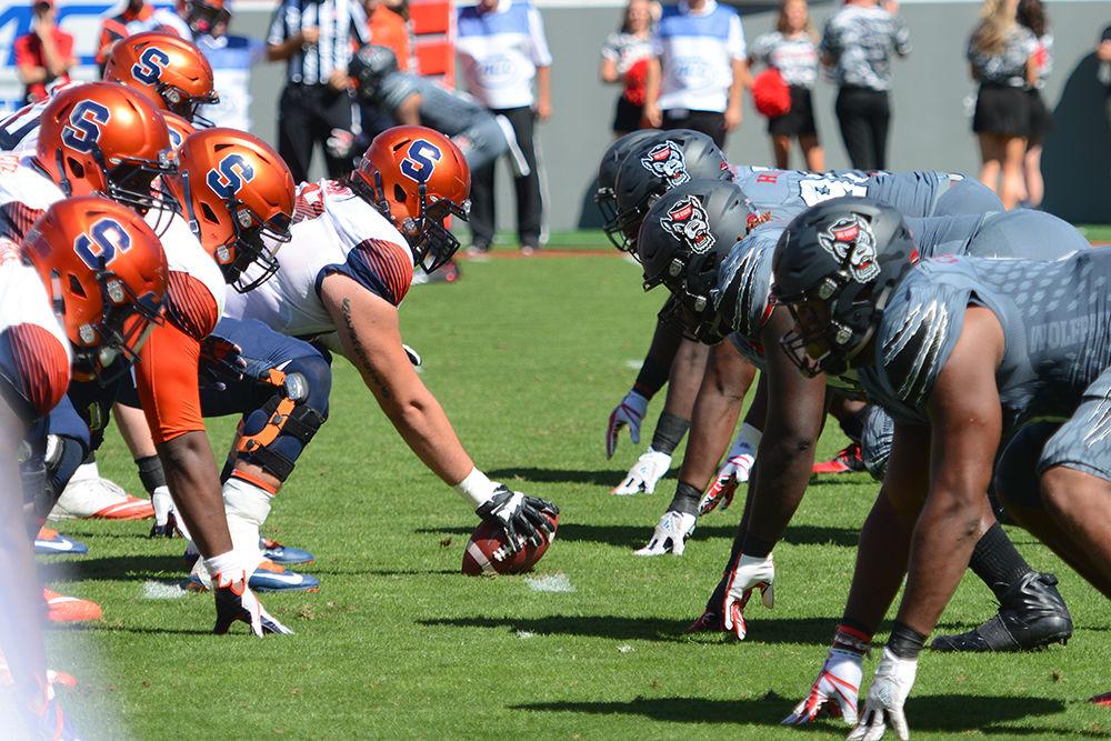 The NC State defense lines up to start another play. The NC State football team beat Syracuse 33-25 at Carter-Finley Stadium on Saturday.