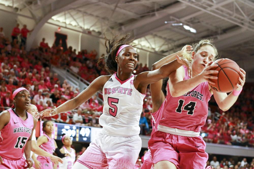 Junior forward Chelsea Nelson reaches for a rebound in the Wolfpack's annual Play4Kay game on Feb. 19. Nelson made 8 of 17 shots from the field and had 18 total points in the 89-77 loss at Reynolds Coliseum.