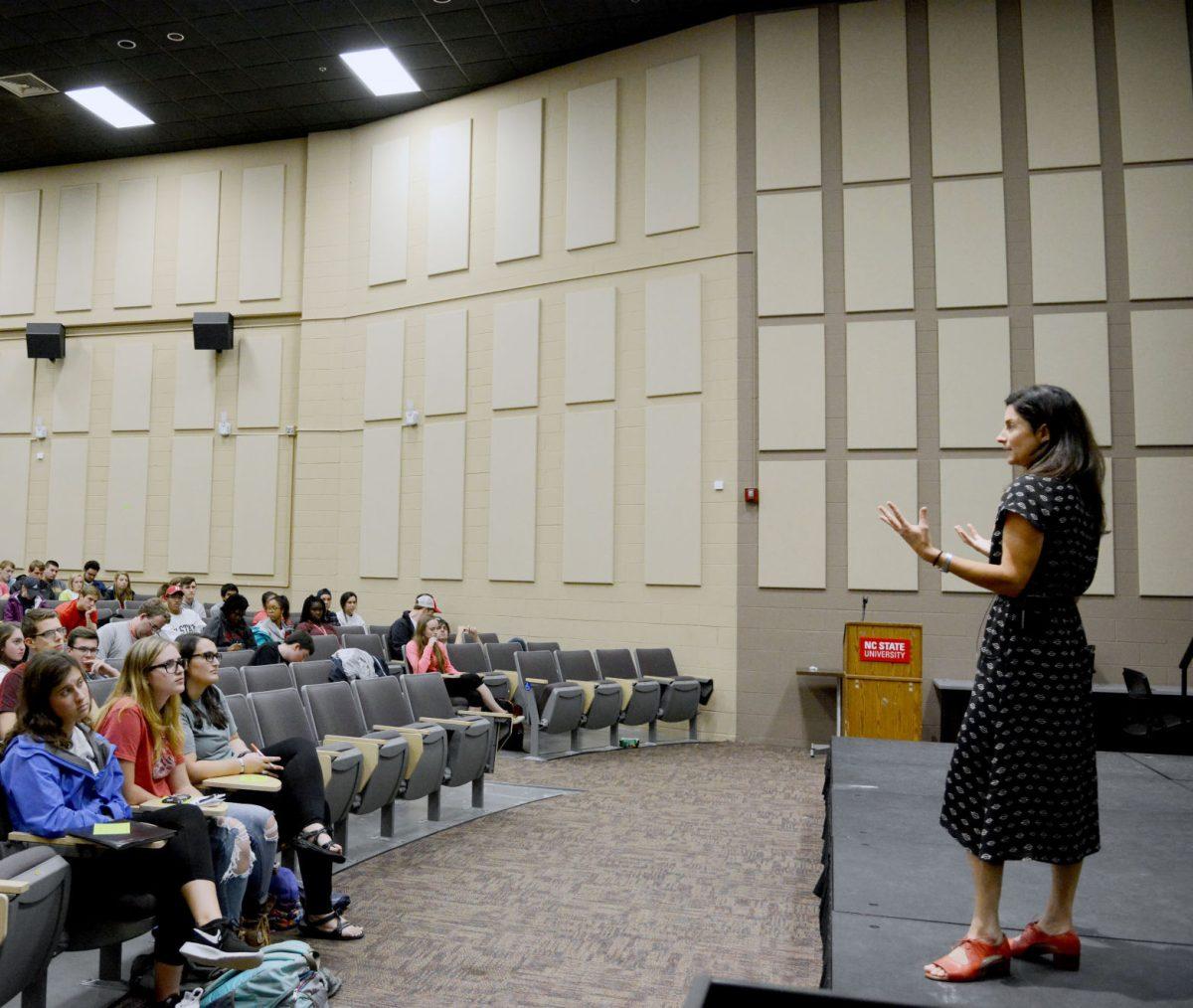 Ami Vitale, professional photographer with National Geographic, answers a question from the audience after her presentation on her international photojournalist experience during a University Scholars Program event in Witherspoon Student Center on Oct. 16.&#160; Vitale emphasized the importance of "reading past the headlines" and developing a sense of empathy, which she believes is "the most important quality to have as a storyteller."