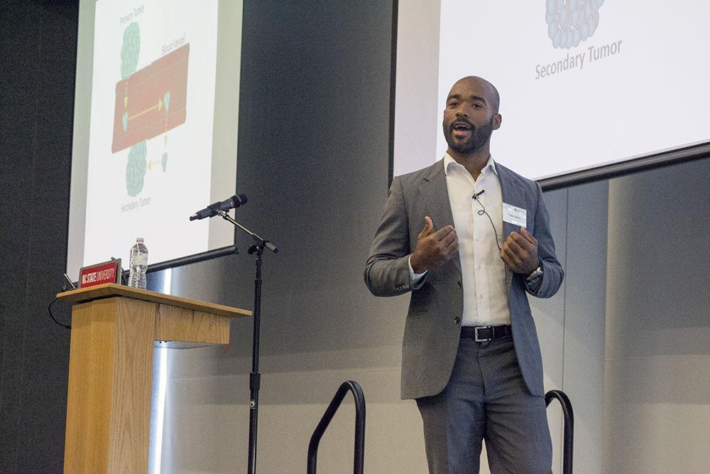 Tyler Allen, a Ph.D. student studying molecular biomedical sciences, gives his three-minute thesis in Hunt Library on Tuesday. Allen came in second place and won $750.