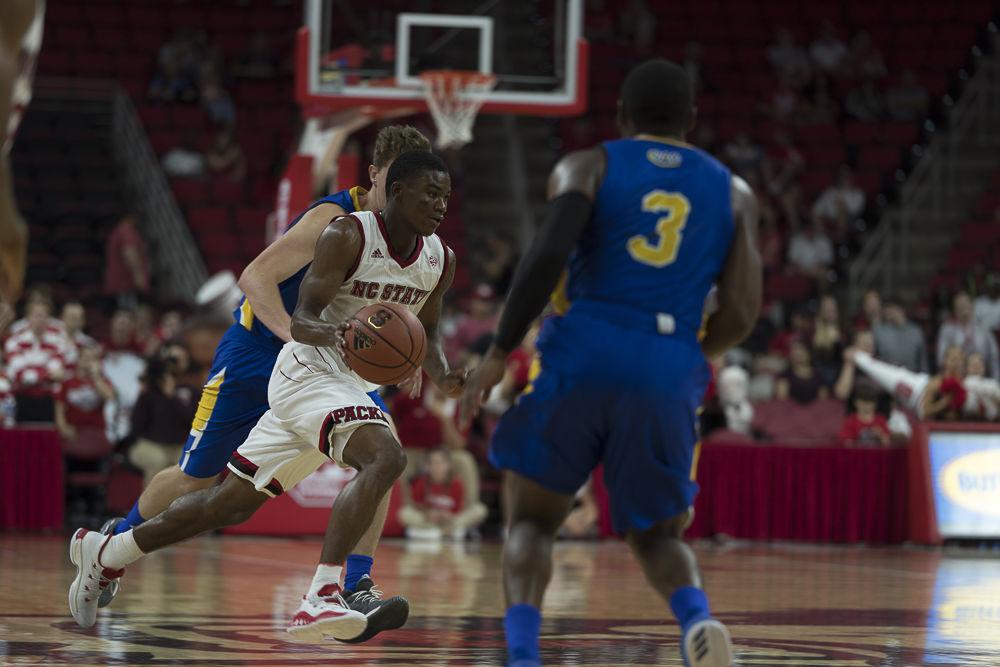 Sophomore guard Markell Johnson runs down the court during an exhibition game against Mars Hill at PNC Arena on Friday November 3.