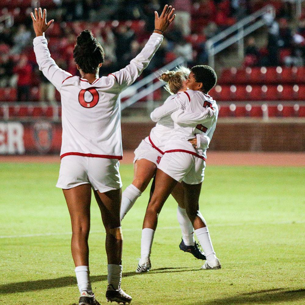 Sohpmore midfielder Tziarra King hugs sophomore midfielder Ricarda Walking after her goal in the 82nd minute, her second of the day. The Wolfpack came away with a 2-1 win to clinch the third seen for the ACC tournament on Thursday, Oct. 26 in Dail Soccer Stadium.