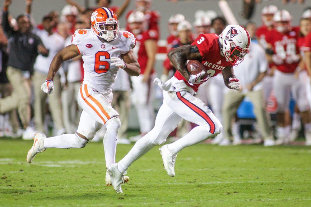 Sophomore wide receiver Kelvin Harmon gets around the Clemson defense for what would be a big gain, called back by an illegal block in the back. Harmon led the team with 155 yards through the air. Despite the 38-31 heartbreaking loss in the final seconds Harmon said that "We've still goa a lot to play for. We've got Boston Colelge next week, so we're going to come back to work tomorrow and stay with our same routine." The Wolfpack fell to Clemson on Saturday, Nov. 4 in Carter-Finley stadium.