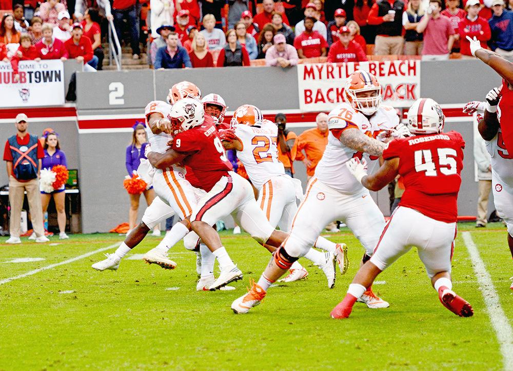 Senior defensive end Bradley Chubb lays a huge hit on Clemson quarterback Kelly Bryant just a split-second after Bryant released the ball. Chubb and the cherished NC State defensive front were not as present in the backfield as they have been in previous games accumulating no sacks and only 2 tackles for loss in the 38-31 loss to Clemson on Nov. 4 at Carter-Finley Stadium.