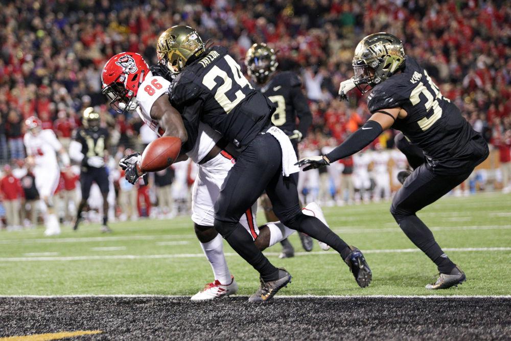 Freshman wide receiver Emeka Emezie gets stripped by Wake Forest's freshman defensive back Ja'Sir Taylor right before he crosses the endzone. Emezie had a career day with five receptions for 67 yards and a touchdown, but the pack's inability to hold the ball with four fumbles, and three overall turnovers cost them the game. Despite outgaining Wake Forest 502 to 334, the Pack fell in heartbreaking fashion 30-24 on Saturday, No. 18 at BB&amp;T field.