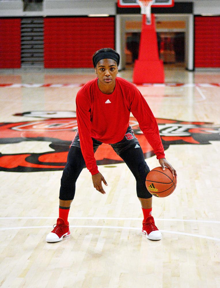 Redshirt junior Kiara Leslie dribbles a ball in Reynold's Coliseum before practice on Wednesday. Leslie graduated from University of Maryland after playing two seasons and is now a guard for the NC State women's basketball team.