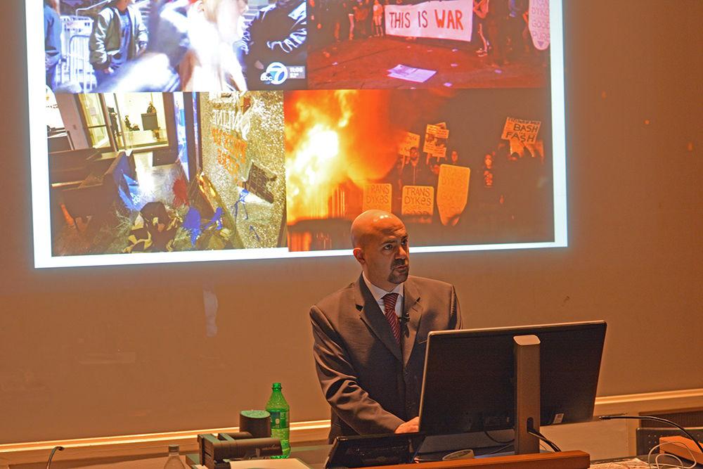 Robert Shibley, executive director of the Foundation for Individual Rights in Education (FIRE) speaks about free speech on college campuses in Poe Hall on Wednesday. FIRE aims to promote free speech, but without violence as shown in these images from the presentation.