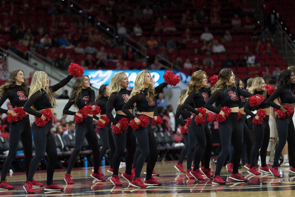 The NC State dance team dancing at a time out durring an exhibition game against Mars Hill at PNC Arena on Friday November 3.