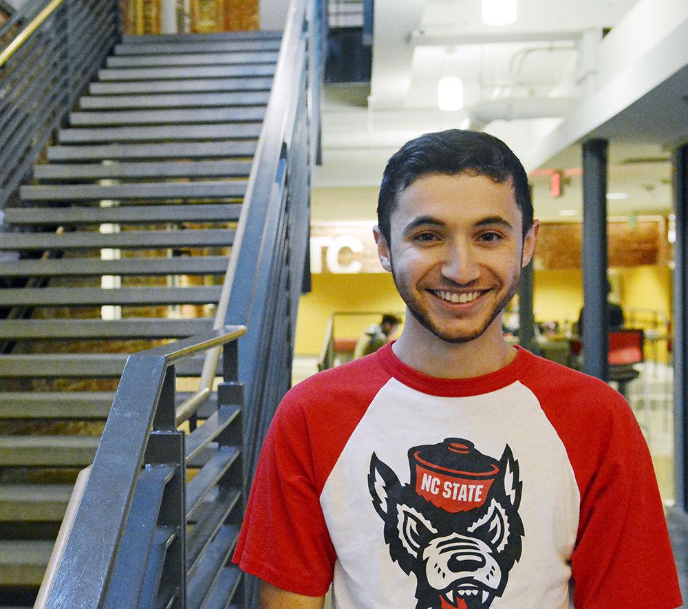 Leader of the Pack Victor Eduardo, a third-year studying philosophy, poses inside Park Shops on Thursday. The Leader of the Pack title is awarded to a student who makes significant contributions to NC State leadership and community service. "I'm a fan of Park Shops because it's close to all of the spots where I would usually take classes," Eduardo said.