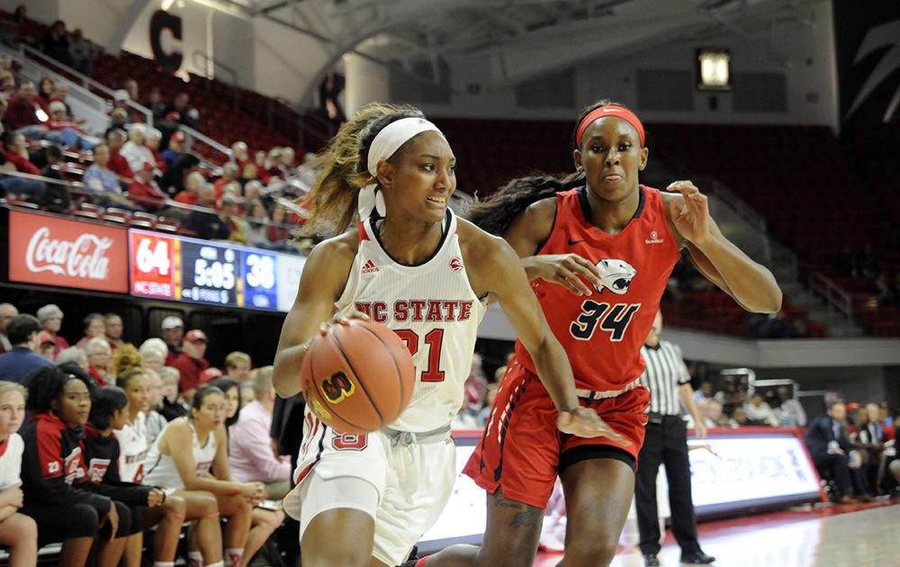 Junior forward DD Rogers runs past the Southern Alabama defense at the N.C. State V. University of Southern Alabama women's basketball game in Reynolds Coliseum on Friday, Nov. 8. The Wolfpack women's basketball team won against the Jaguars 71-50 in a thus far undefeated normal season.