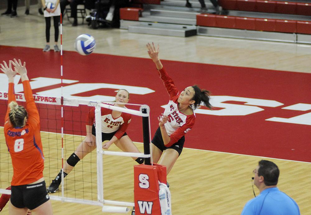 Graduate outside hitter Bree Bailey spikes the ball over the net at the N.C. State Volleyball match against Clemson in Reynolds Coliseum on Thursday, Nov. 9. Bailey finished the game with 16 kills, leading the Wolfpack to a 3-1 victory against the Clemson Tigers.
