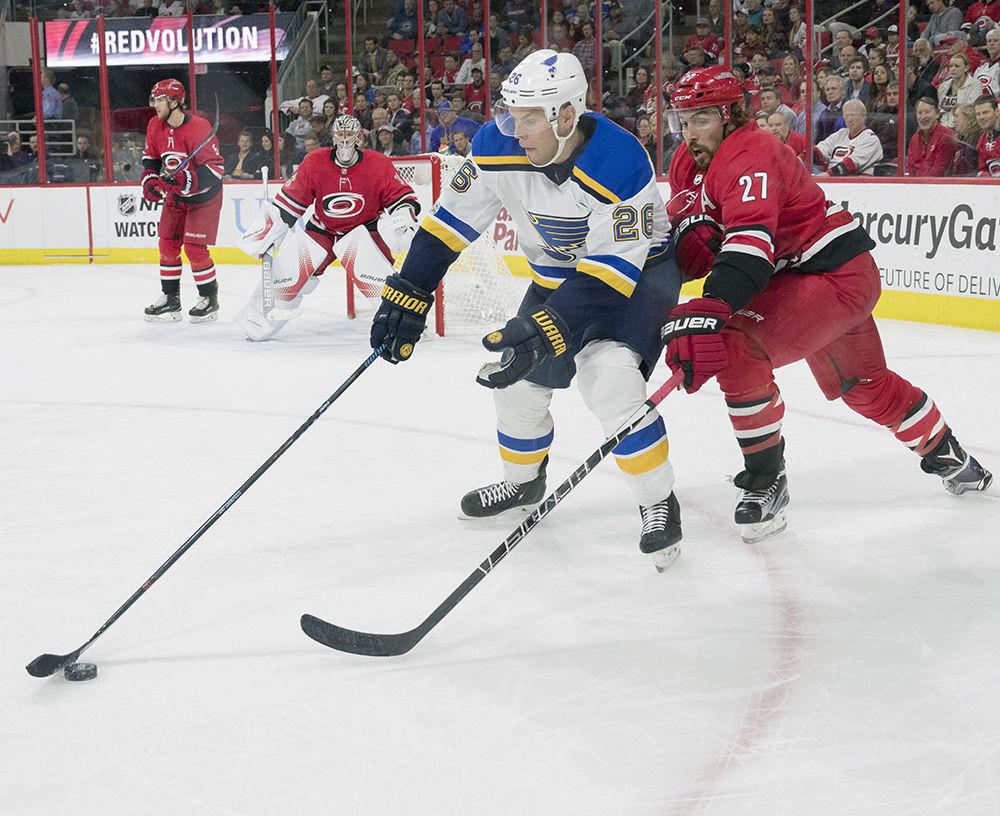 Canes defenseman Justin Faulk attempts to poke check the puck out of Blues center Paul Stastny in the second period. Canes dropped the Game to the Blues 2-1 at PNC Arena on Oct. 27 for a home record of 1-2-1. The Hurricanes are currently seventh in the Metropolitan Division.