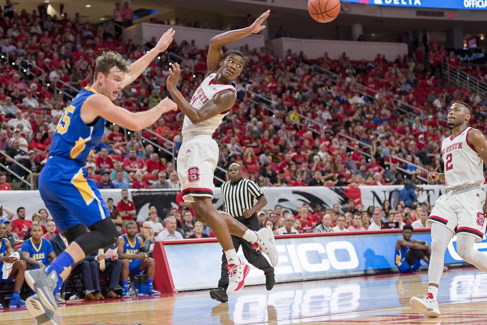 Sophmore guard Markell Johnson passes the ball off durring an exhibition game against Mars Hill at PNC Arena on Friday November 3.