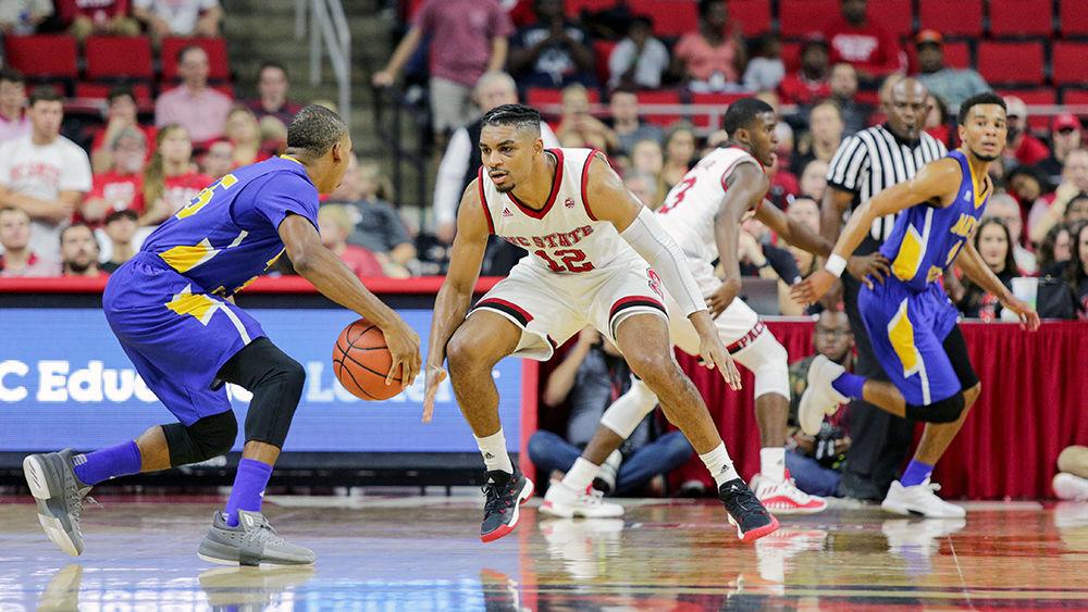 Graduate transfer guard Allerik Freeman stands his guard on defense. Freeman had 18 points to go along with eight boards. The Wolfpack showed off its new defense and a high-powered offense with a 109-66 win over Mars Hill on Nov. 3 in PNC Arena.
