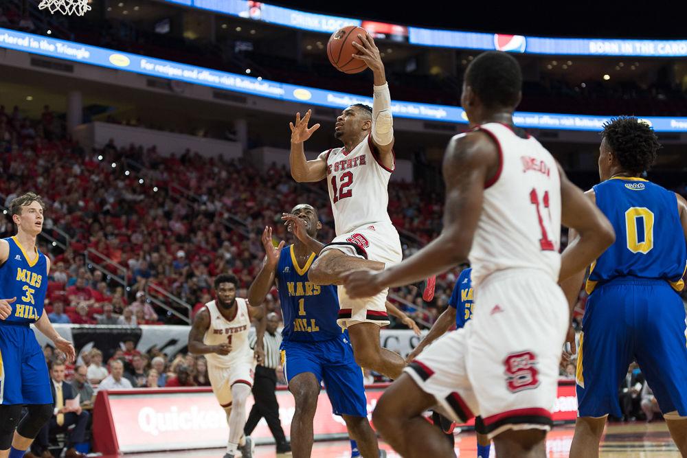 Graduate transfer guard Allerick Freeman goes up for a layup against Mars Hill durring an exhibition game at PNC Arena on Friday November 3.