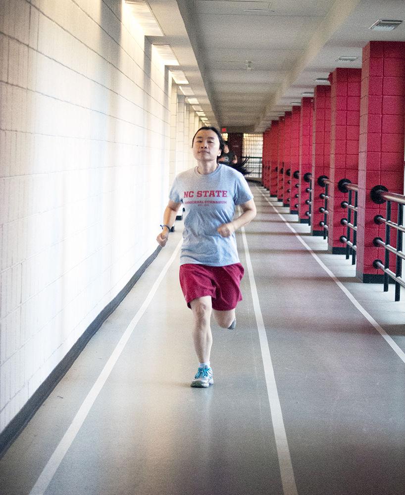 Wen Lin, an alumna who studied Forestry runs around the indoor track in Carmichael Gymnasium on Oct. 20. The indoor track, approximately one sixth of a mile in length, is one of the many attractions including two full sized pools, multiple weight rooms, tennis courts and basketball courts.