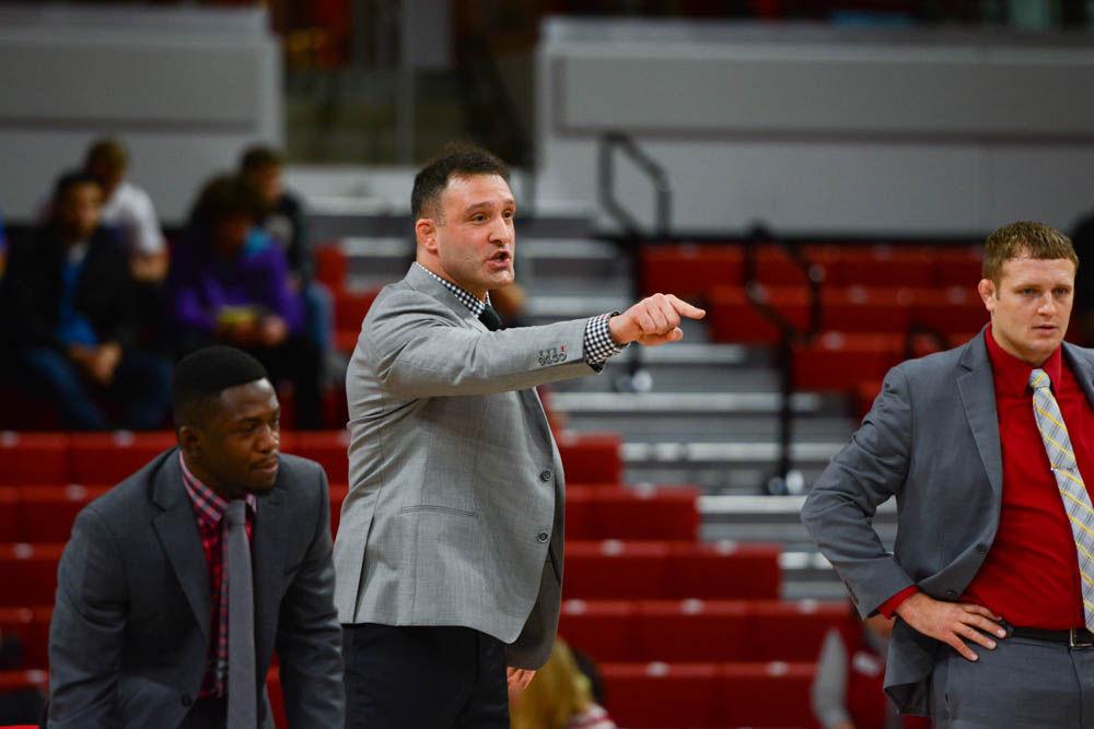 Head coach Pat Popolizio motivates an NC State wrestler. The NC State wrestling team beat Duke 34-6 in the ACC opener at Reynolds Coliseum on Jan. 11, 2017.