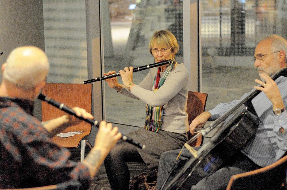 Assistant professor Alison Arnold performs Irish folk songs and alongside other musicians as part of "The Irish Session" in the One Earth lounge area on Tuesday, Nov. 7. The Irish Session performs every Tuesday during the semester at 5:00pm at One Earth. The group welcomes newcomers of varying skill level and perform a concert once per semester in Stewart Theater.