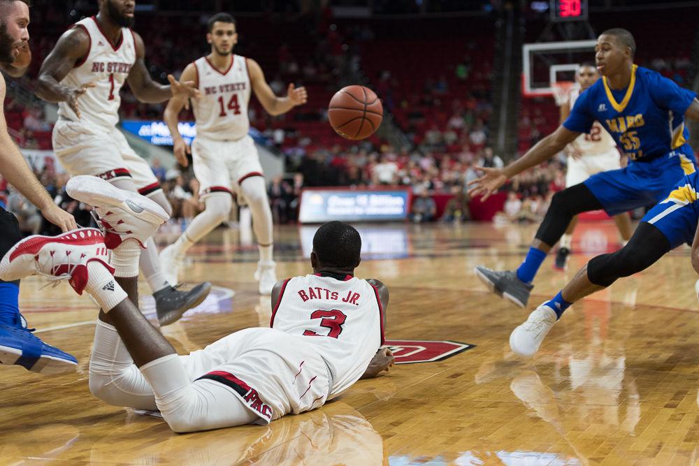 Freshman guard Lavar Batts passes the ball after diving to keep possession durring an exhibition game against Mars Hill at PNC Arena on Friday November 3.
