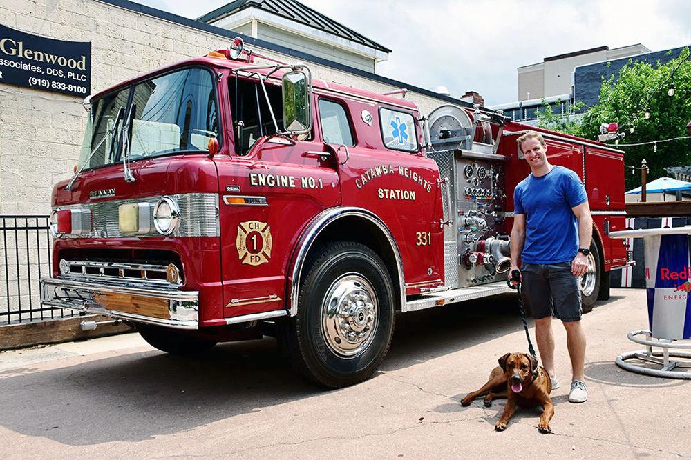 Anthony Battaglia stands with the booze cruise he runs with his fellow firefighter Ryan Nelson. The business has been operating since June.