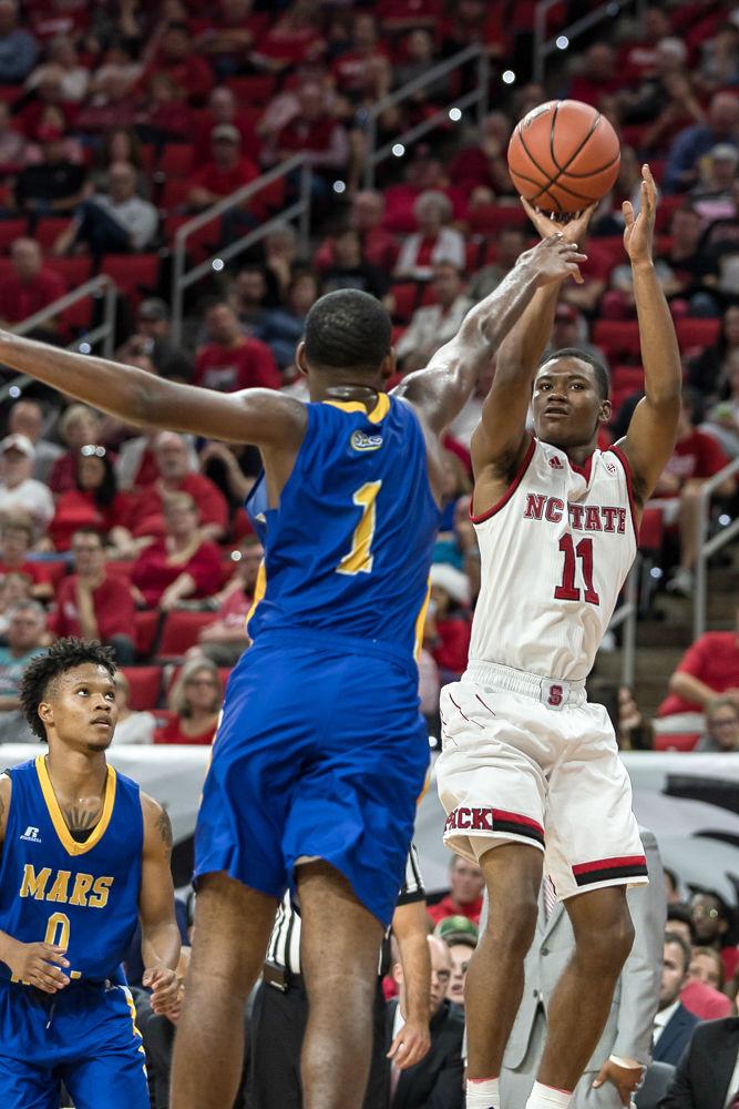 Sophomore guard Markell Johnson goes up for a jumper during an exhibition game against Mars Hill at PNC Arena on Friday.