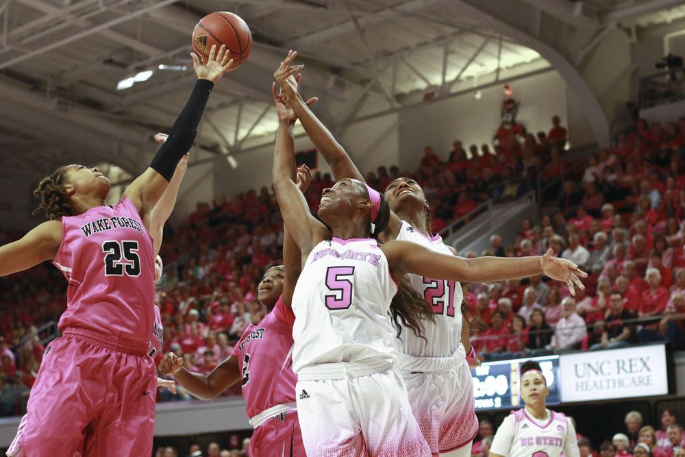 Junior forward Chelsea Nelson and sophomore forward DD Rogers reach for a rebound in the Wolfpack's annual Play4Kay game at Reynolds Coliseum on Feb. 19. Nelson grabbed 11 rebounds and Rogers grabbed 2 in the 89-77 loss to Wake Forest.