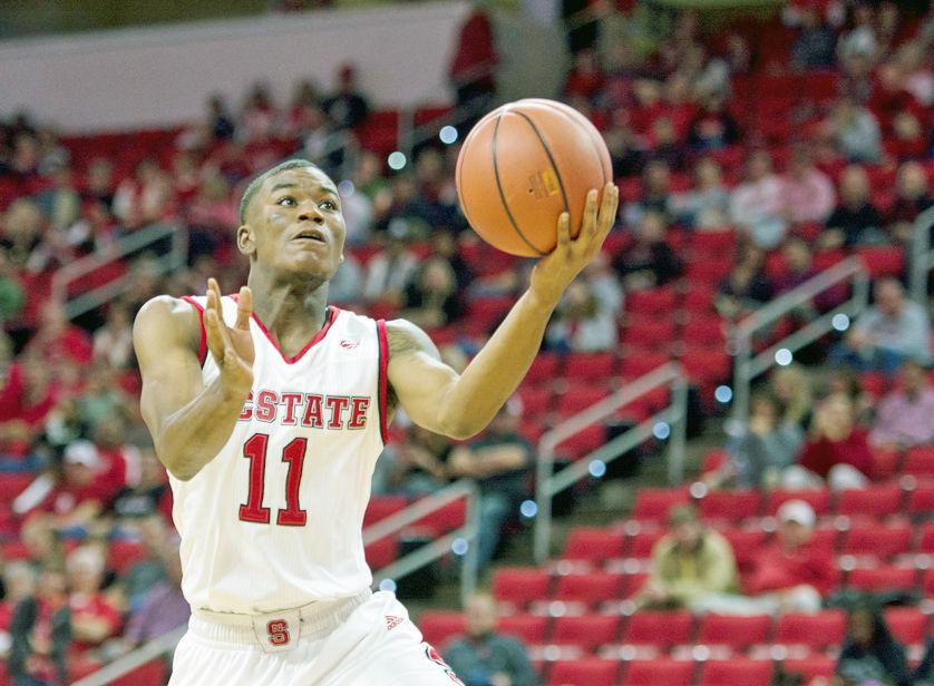 Sophomore guard Markell Johnson drives the lane and elevates for a lay-up. He had an efficient game shooting 5 for 9 from the field, 100 percent from the free throw line and one assist shy of a double-double. The Wolfpack blew past Virginia Military Institute 102-67 on Friday at PNC Arena.