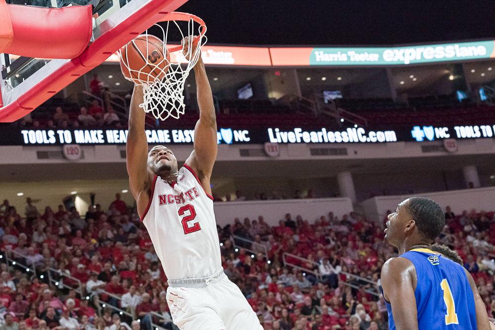 Redshirt Junior guard Torin Dorn dunks against Mars Hill durring an exhibition at PNC Arena on Friday November 3.