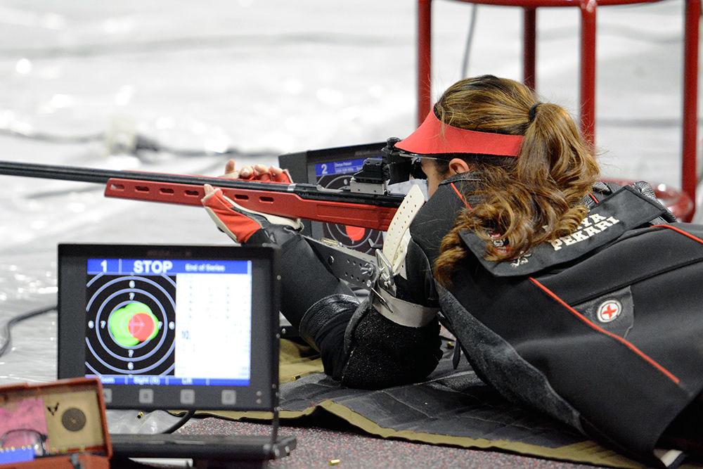 Derya Pekari, a senior studying communication, takes aim at her target while in the prone position at Reynolds Coliseum on Oct. 21. Pekari scored 554 in small-bore and took second place in the air rifle finals, registering a score of 245.2. The Wolfpack went up against the Akron Zips on Saturday, coming out with a 4656 to 4642 aggregate win.