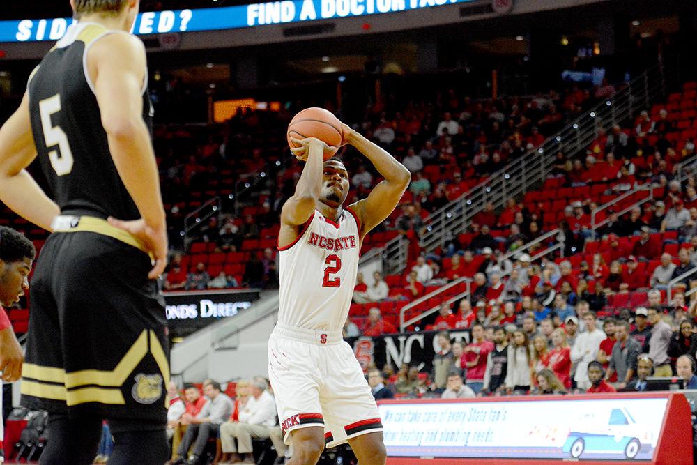 Redshirt junior guard Torin Dorn prepares for a free throw during NC State's game against Bryant on Tuesday in PNC Arena. The Wolfpack beat the Bulldogs, 95-72, for their fourth win this season.