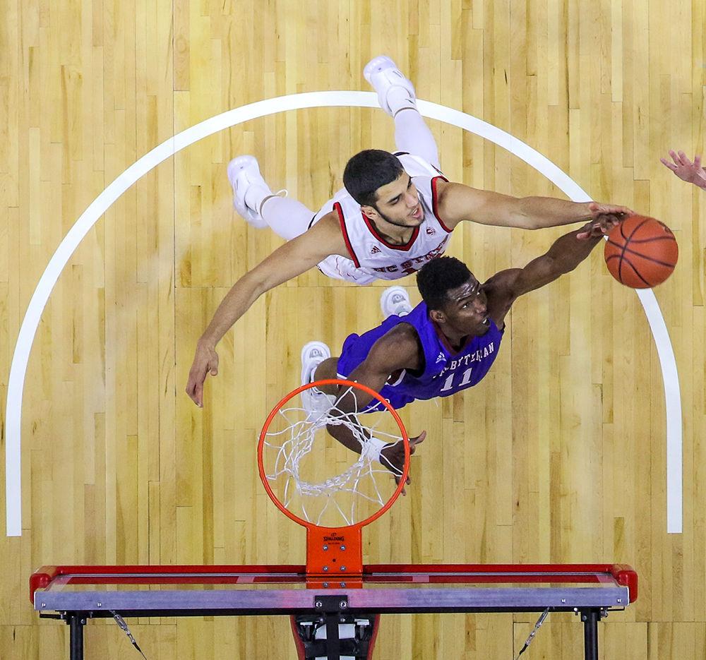 Sophomore center Omer Yurtseven goes up for a rebound during the 86-68 win over Presbyterian College on Nov. 16 in PNC Arena.
