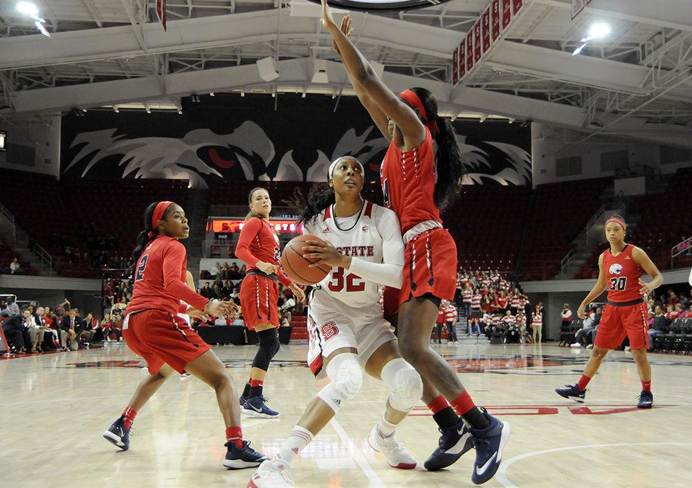 Senior center Akela Maize looks for a opening to score at the N.C. State V. University of Southern Alabama women's basketball game in Reynolds Coliseum on Friday, Nov. 8. The Wolfpack women's basketball team won against the Jaguars 71-50 in a thus far undefeated normal season.