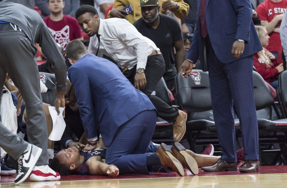 South Carolina senior guard, Tyvoris Solomon, receives CPR after collapsing with 13:08 left in the first half of the game in PNC Arena on Saturday. NC State beat the Bulldogs 103-71.