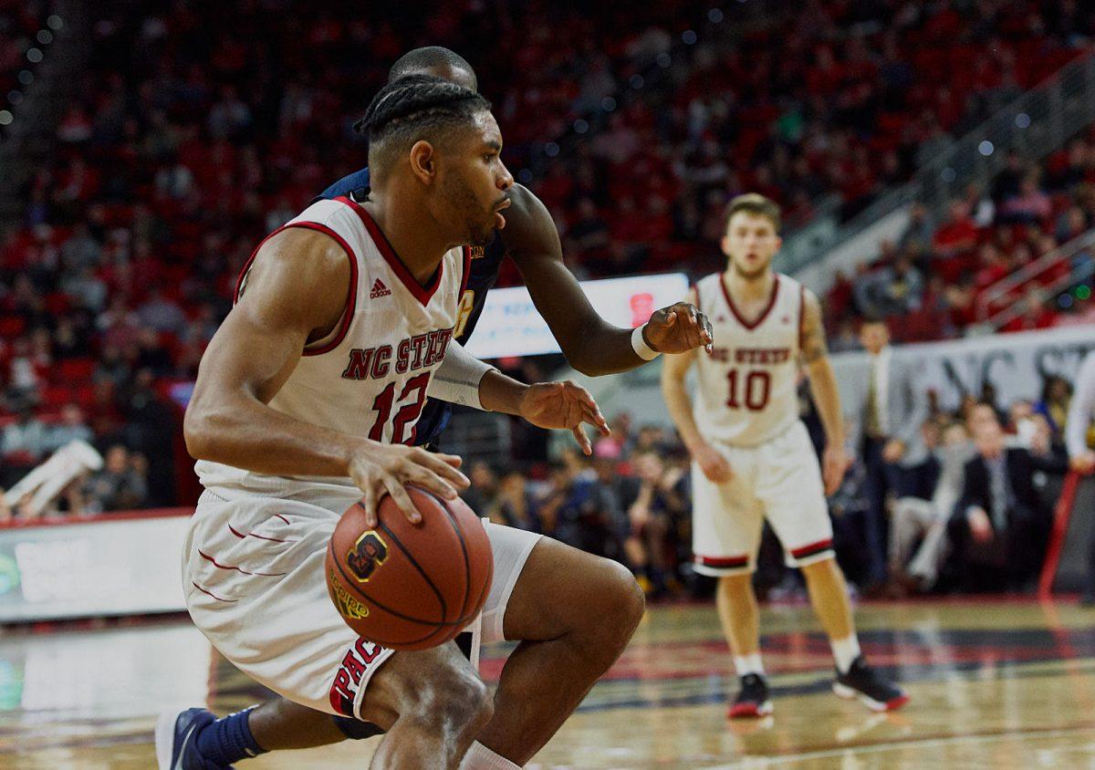 Graduate student guard Allerick Freeman makes a push for the basket in the second half of the 81-76 loss against UNC Greensboro at PNC Arena on Saturday.