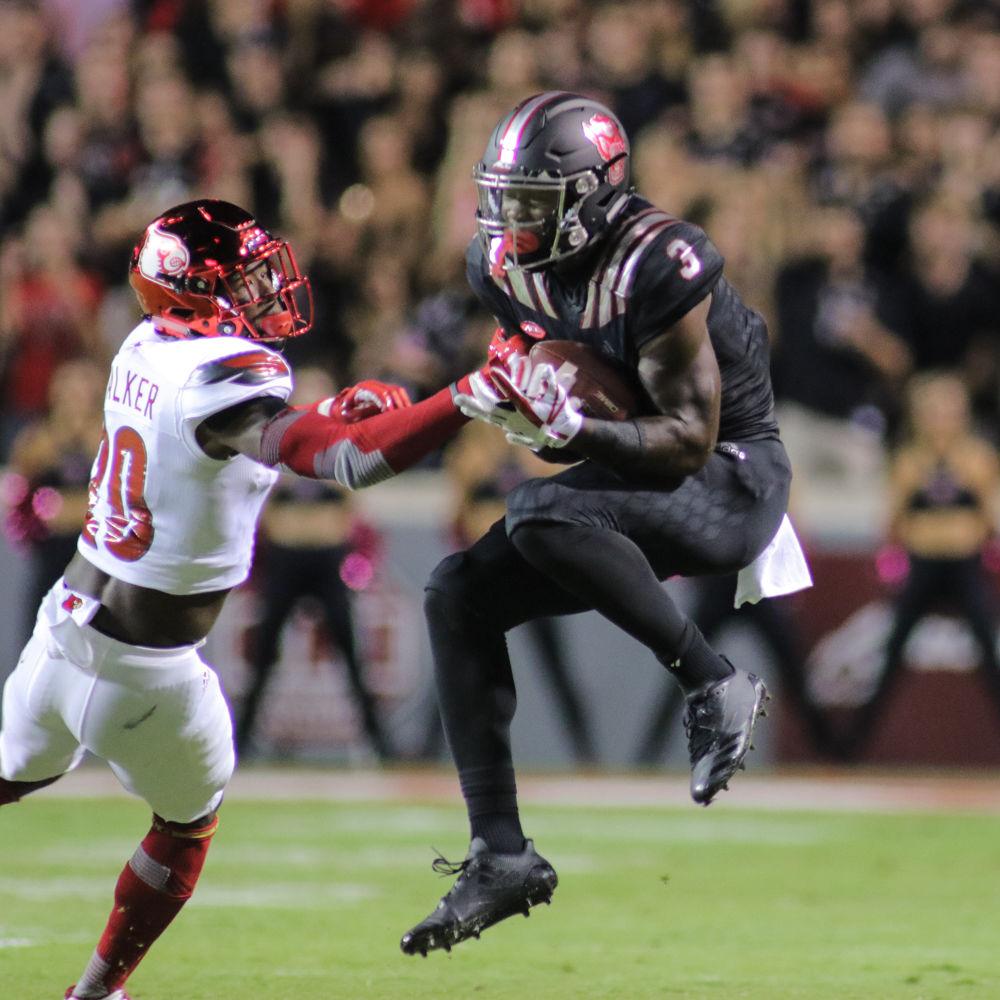 Sophomore wide receiver Kelvin Harmon makes a catch. Harmon had big day, leading the team with 133 yards through the air. The Wolfpack took down No. 17 Louisville 39-25 on Thursday, Oct. 5 in Carter-Finley Stadium.