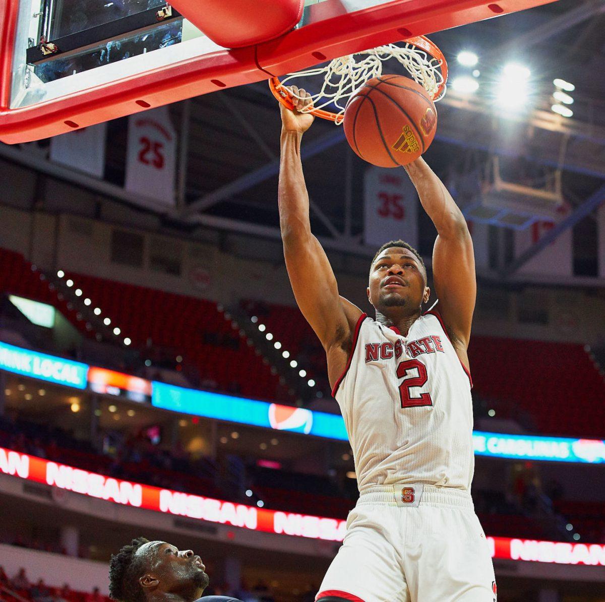 Redshirt junior Torin Dorn dunks the ball with 1:00 minute left in the second half against Robert Morris for a 81-65 win at PNC Arena on Tuesday, Dec. 19. Dorn recorded a double-double leading the team with 17 points while also putting up 10 boards.