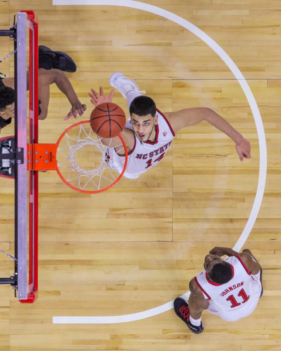 Sophomore center Omer Yurtseven knocks the ball away after it had circled the rim. Yurtseven had a team-high of 22 points and six rebounds during the 72-63 win over Wake Forest on Thursday in PNC Arena.