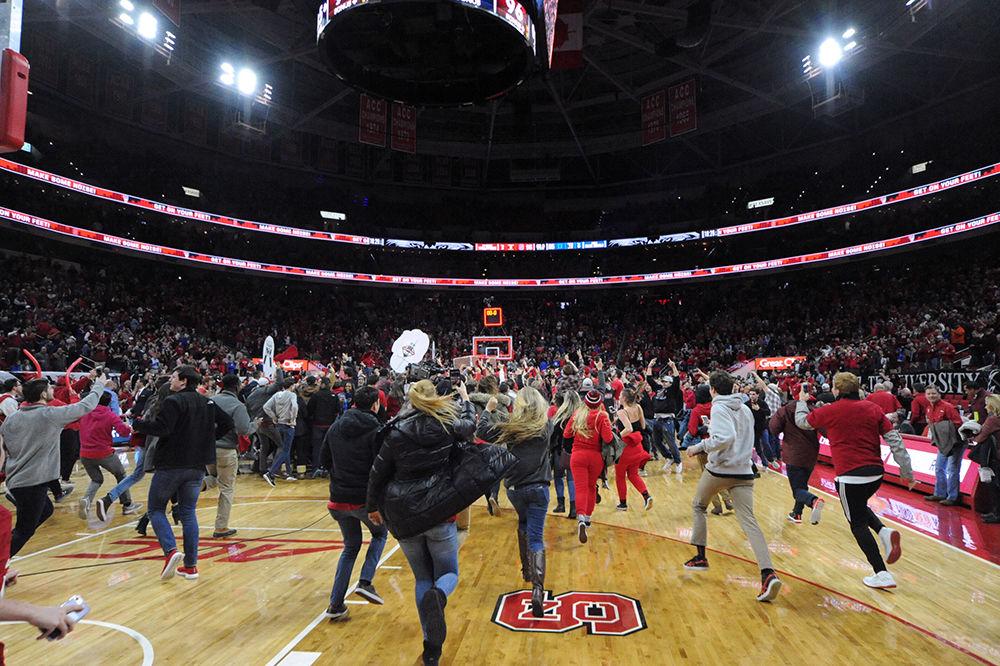NC State students run on the court as the mens basketball team grabbed an amazing win over 2nd ranked Duke Saturday night 96-85.