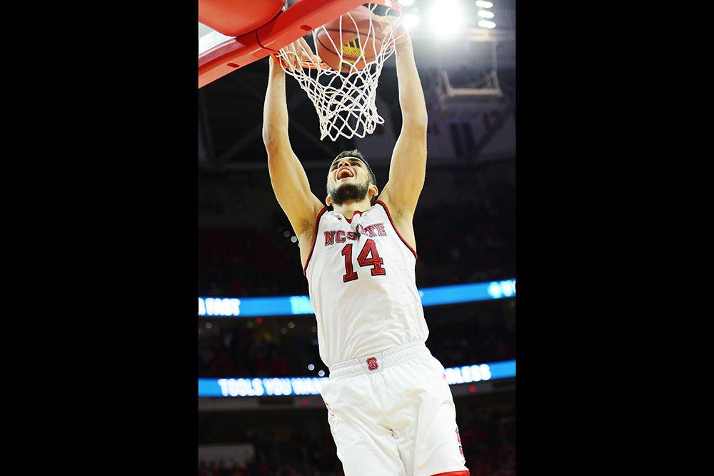 Sophomore center Omer Yurtseven slams home a dunk late in the game against No. 19 Clemson on Thursday, Jan. 11 at PNC Arena. Yurtseven scored a career-high 29 points, including 5 of 6 from 3-point range. The Wolfpack won a nail-biter, 78-77, when Clemson missed it&#8217;s final free throw. The Wolfpack improved to 12-5 this season and 2-2 in ACC play.