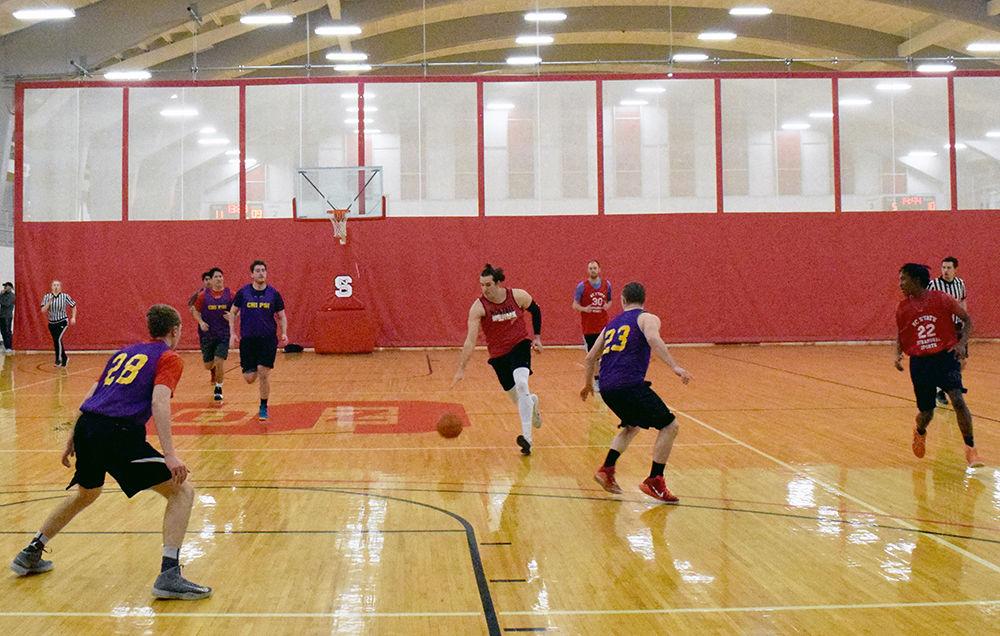 Chi Psi takes on Delta Kappa Epsilon during an intramural basketball game in Carmichael Gymnasium on Tuesday. Intramurals at NC State offer a variety of different games, including: wallyball, soccer, cricket, frisbee, and volleyball. All NC State students are eligible to register for intramural teams their spring semester.