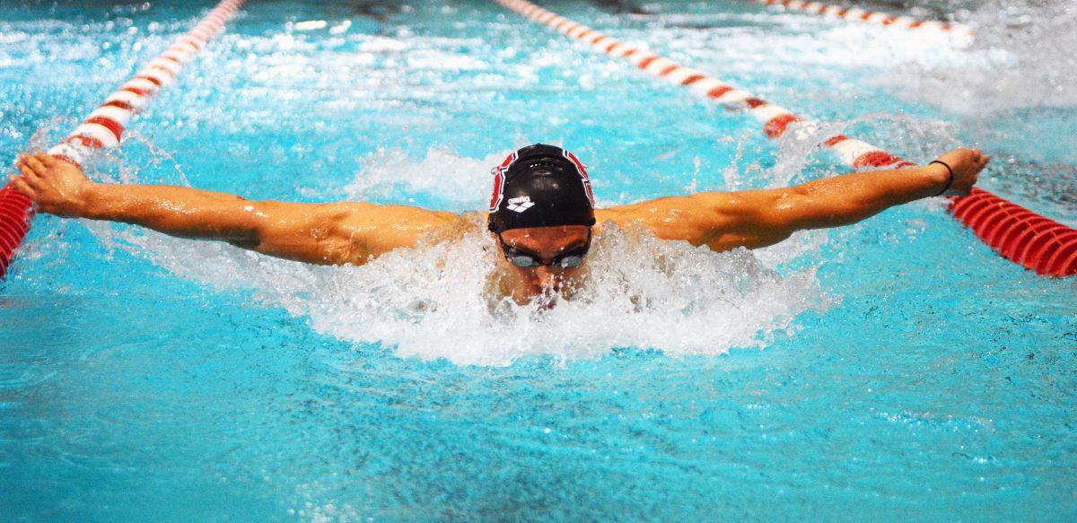 Junior Andreas Vazaios swims in the 200-yard butterfly against UNC-Chapel Hill at the Willis R. Casey Aquatic Center on Jan. 27, 2017. Vazaios came in first in the 200-yard butterfly event with the time of 1 minute and 45.18 seconds. The Wolfpack settled the game against the Tar Heels with a score of 176-69.