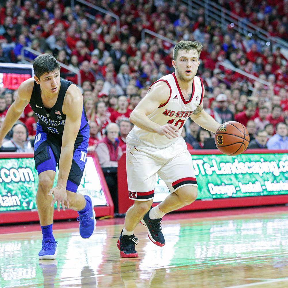 Freshman guard Braxton Beverly breaks around Duke's Grayson Allen. Beverly dished out five assists to go along with 14 points during the 96-85 win over No. 2 Duke in PNC Arena Saturday.